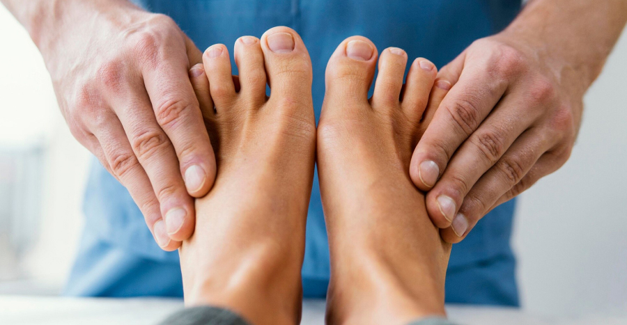 Podiatrist examining a patient’s foot at Morisset Doctors